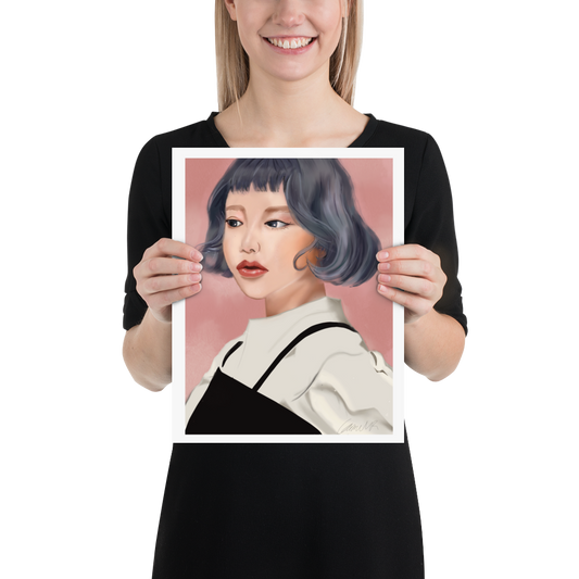 Person holding a digital portrait of a woman with a blue grey bob haircut. By Carmel Rimmer
