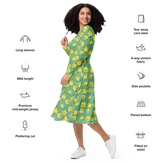 Woman wearing a green dress with yellow daffodil floral pattern by Carmel Rimmer, standing against a white background with product features listed.