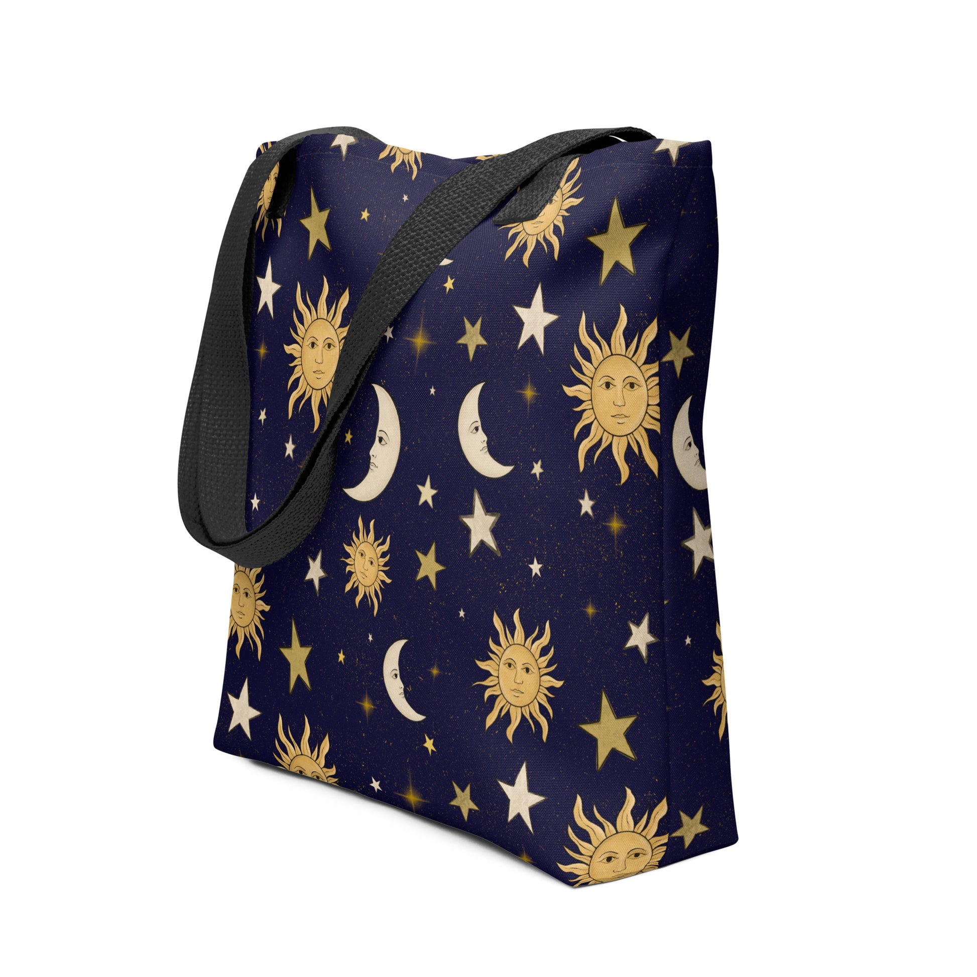 Navy blue tote bag with celestial pattern featuring suns, moons, and stars on a white background