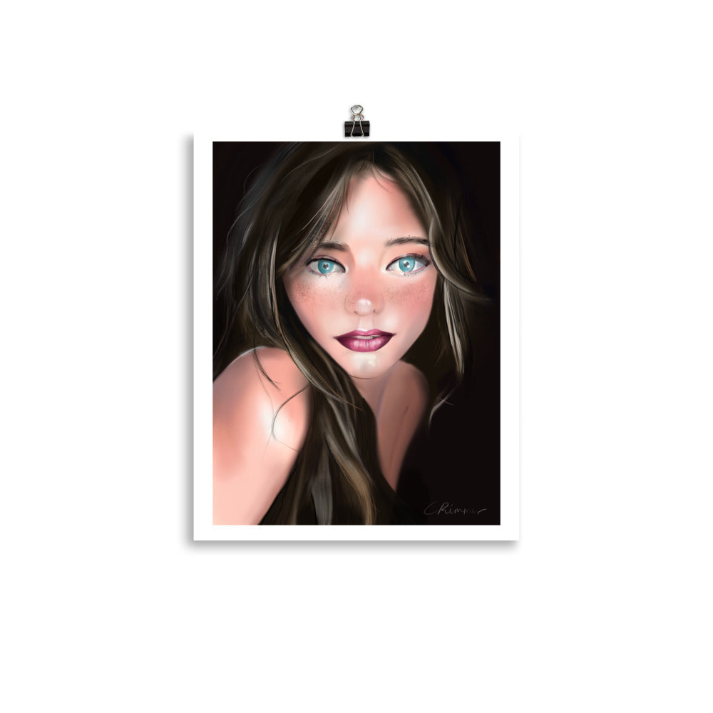 A poster print featuring a stylized artwork of a female figure with prominent blue eyes and a subtle color palette.